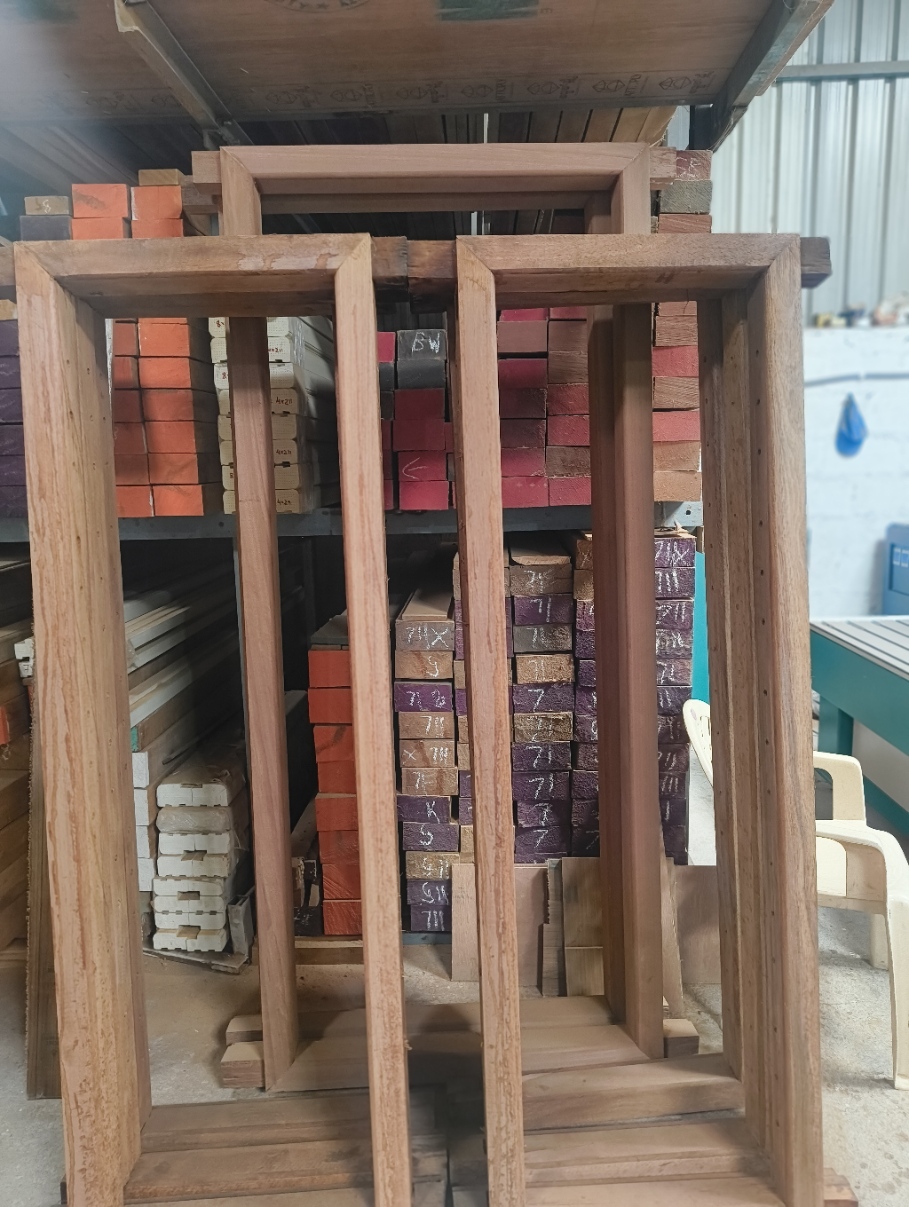 Teak door and window frames at Sri Umiya Timber, Bangalore